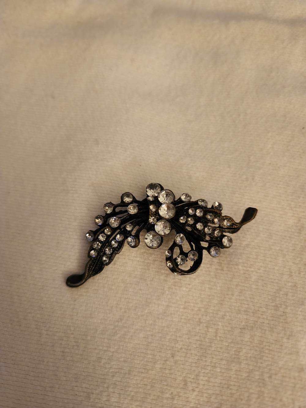 Rhinestone Floral Scroll Brooch - Clear Crystal on Black Metal
